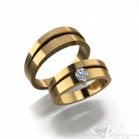 7. 14Krt. Geelgouden trouwringen met 0.25ct diamant. Paar 1950,-